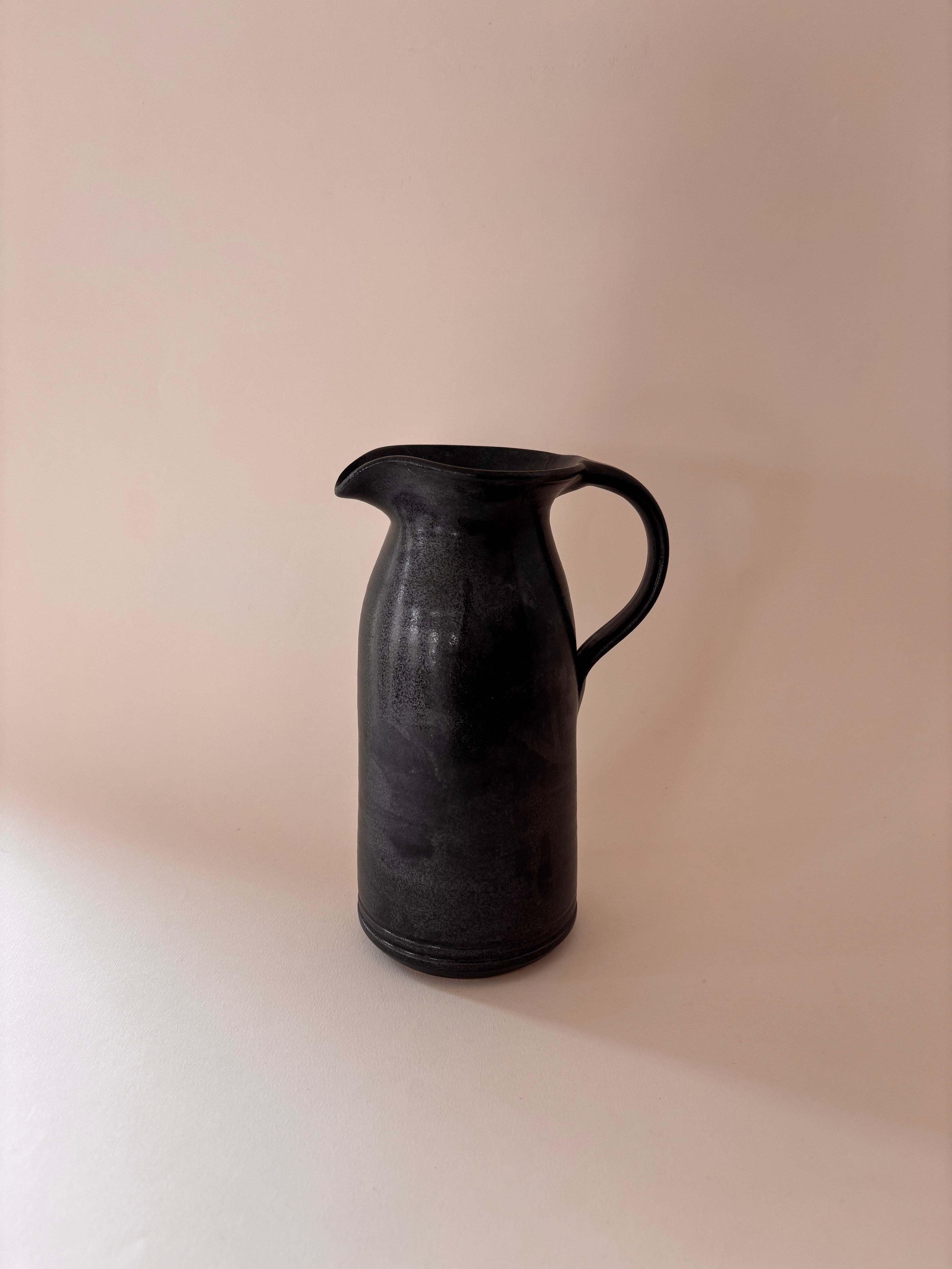 Black glaze vintage stoneware jug with loop handle
