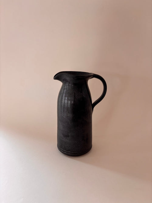 Black glaze vintage stoneware jug with loop handle