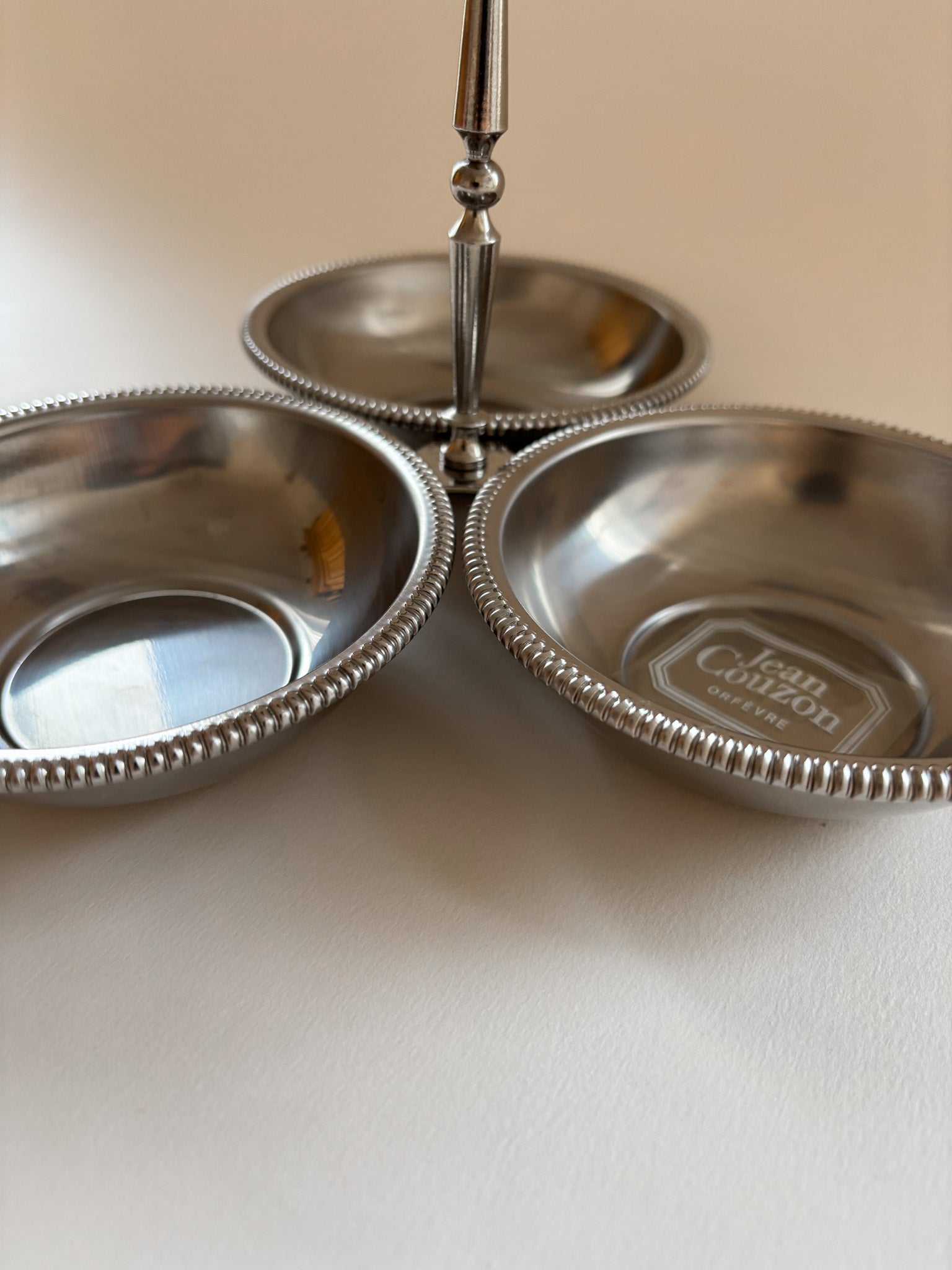 Top view of a vintage Jean Couzon 3 compartment server showing three round bowls and beaded edge detail