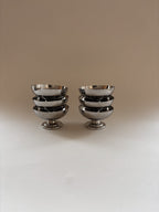 Set of six vintage stainless steel dessert cups by L'Étang & Rémy stacked together.