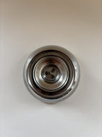 Close-up of L'Étang & Rémy stamp on the base of a vintage stainless steel dessert cup