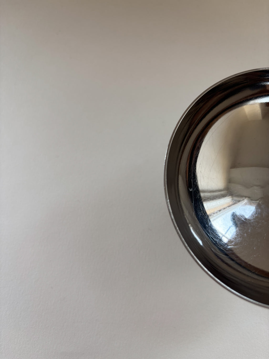 Top view of a vintage stainless steel dessert cup by L'Étang & Rémy showing interior and rim detail