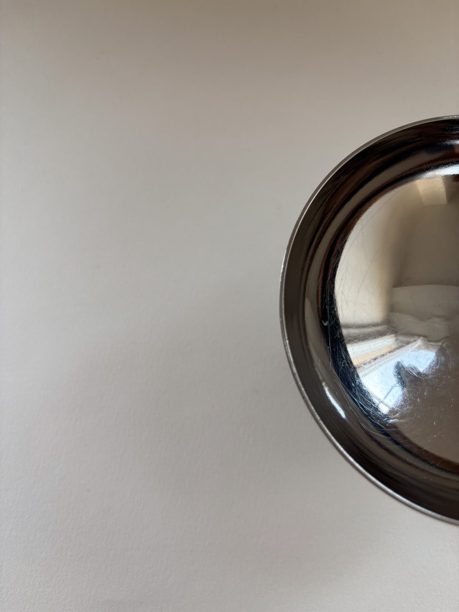Top view of a vintage stainless steel dessert cup by L'Étang & Rémy showing interior and rim detail
