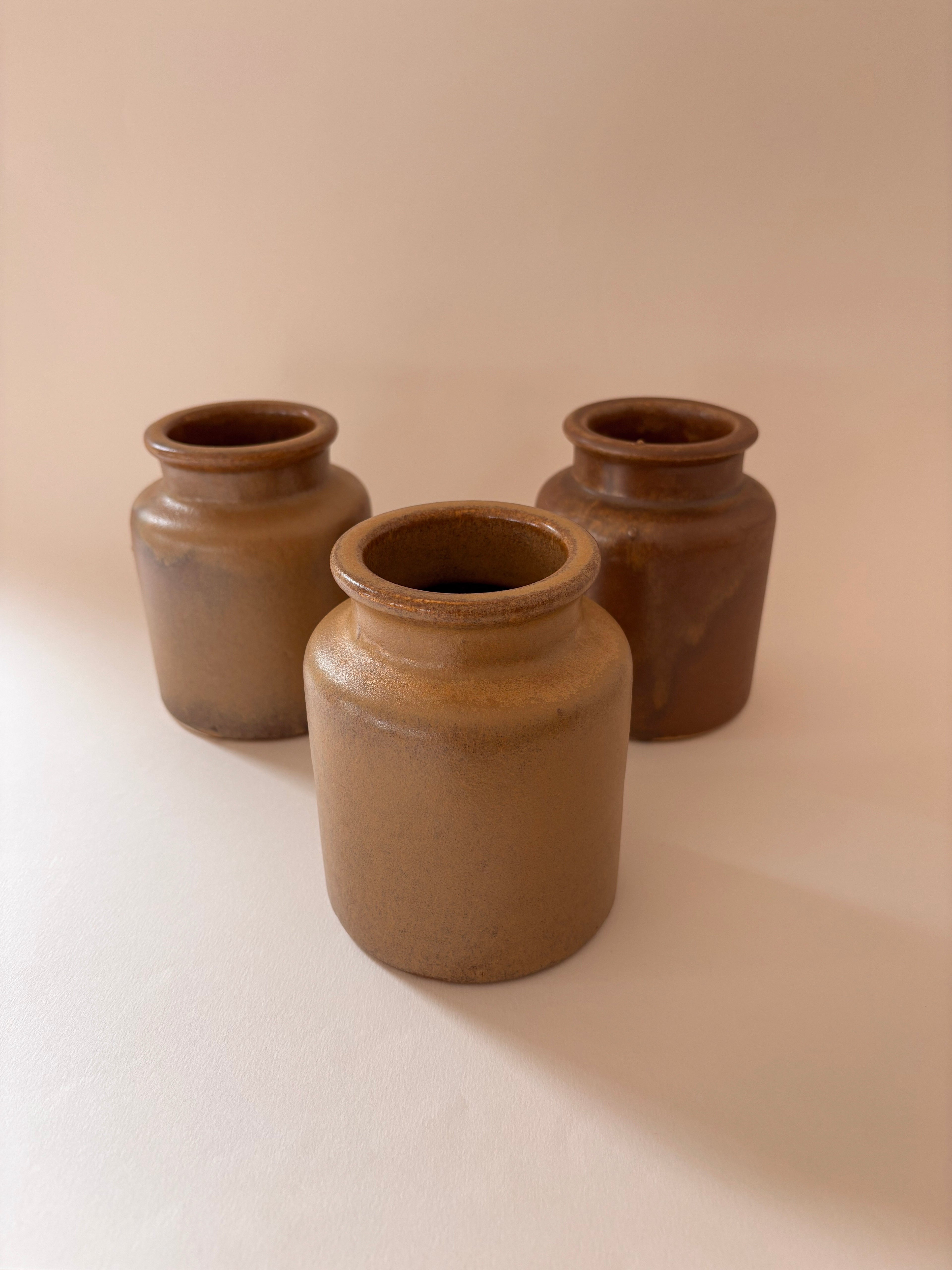 Vintage French stoneware mustard jars showing the rolled rim