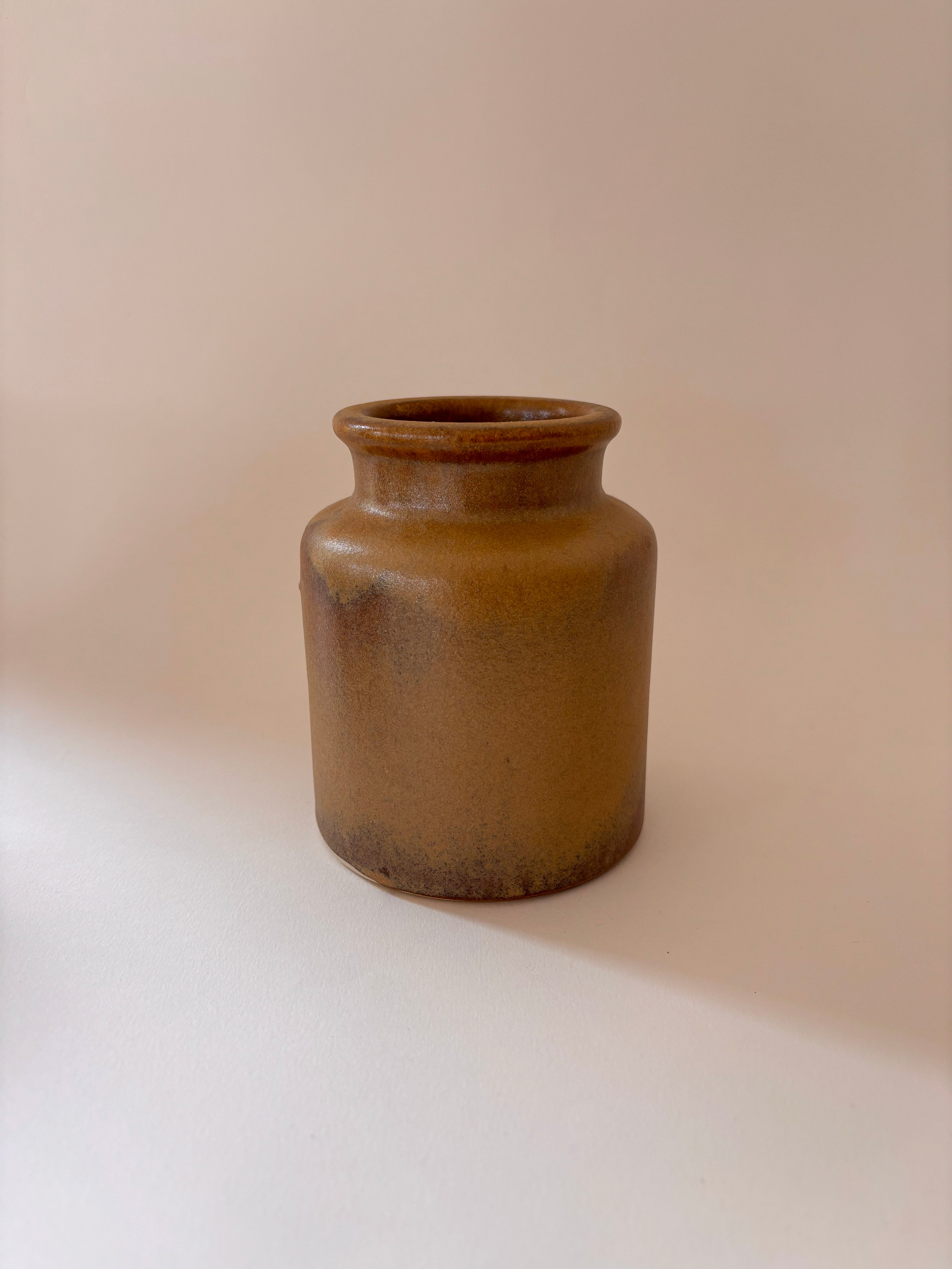 Antique French stoneware mustard jar 1, front view, showing cylindrical form and warm ochre salt-glaze.