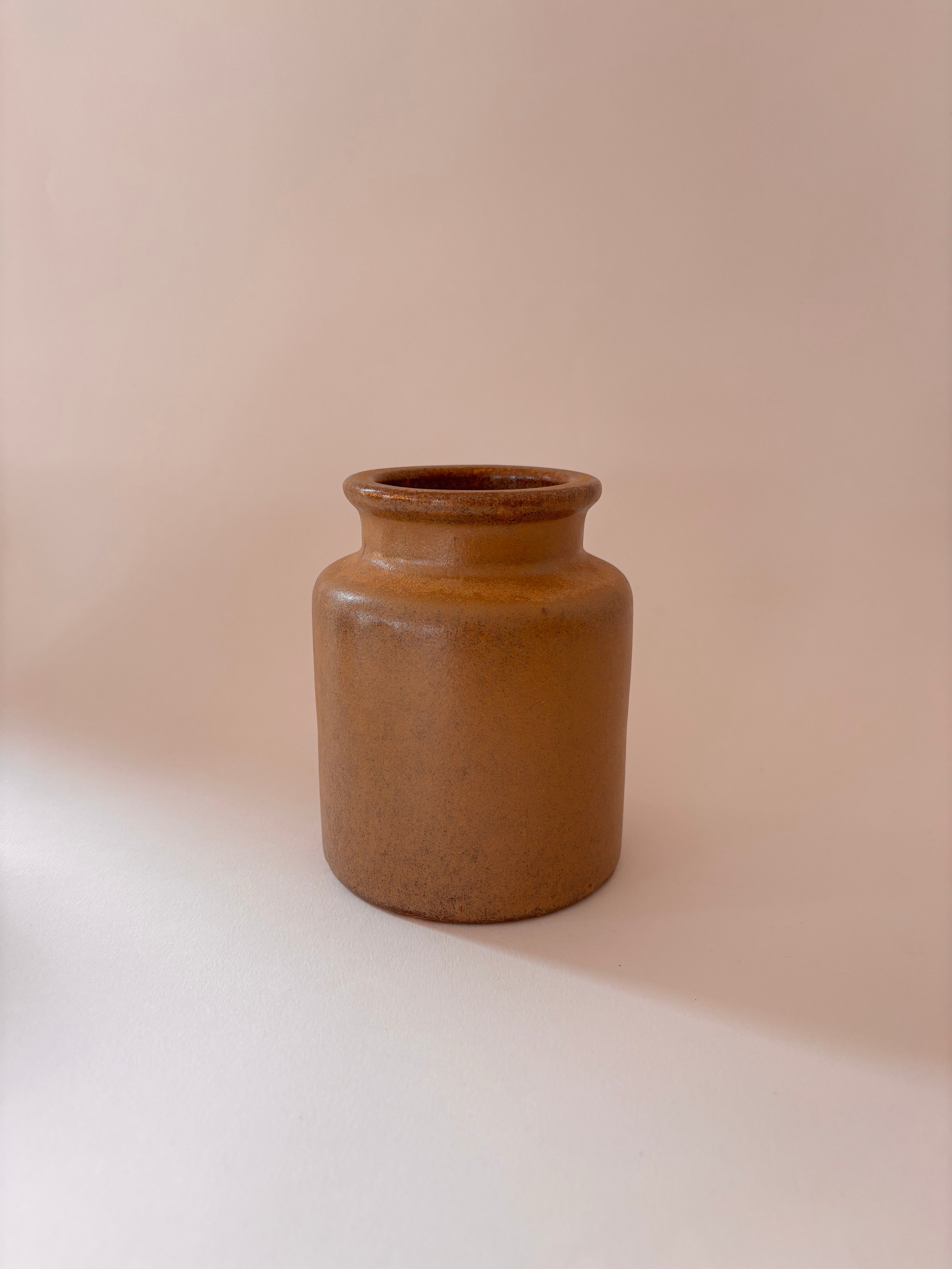 Vintage French stoneware mustard jar, front view, showing cylindrical form and warm ochre salt-glaze.