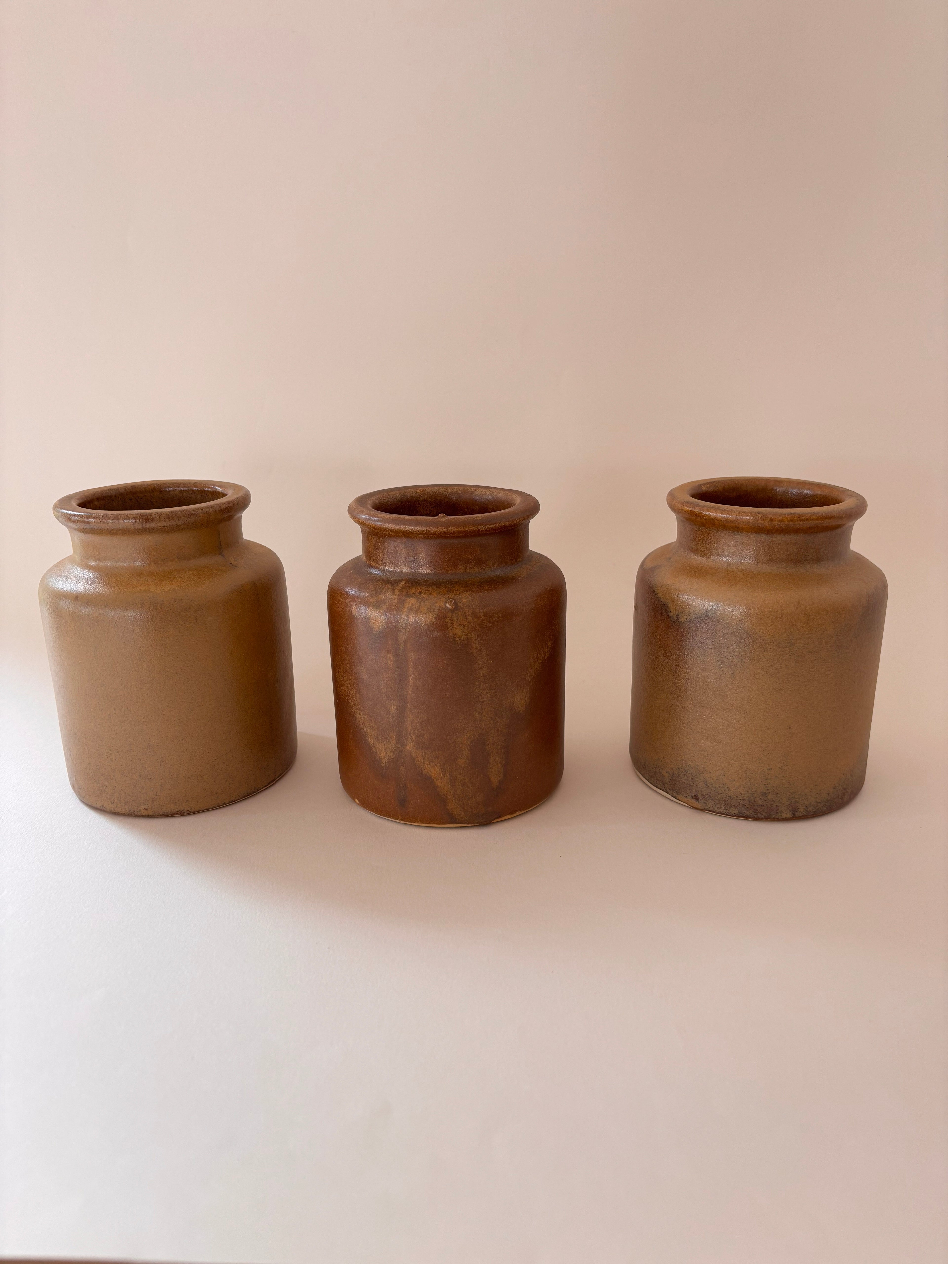 3 vintage French stoneware mustard jars, close-up showing salt-glaze texture, natural colour variations 