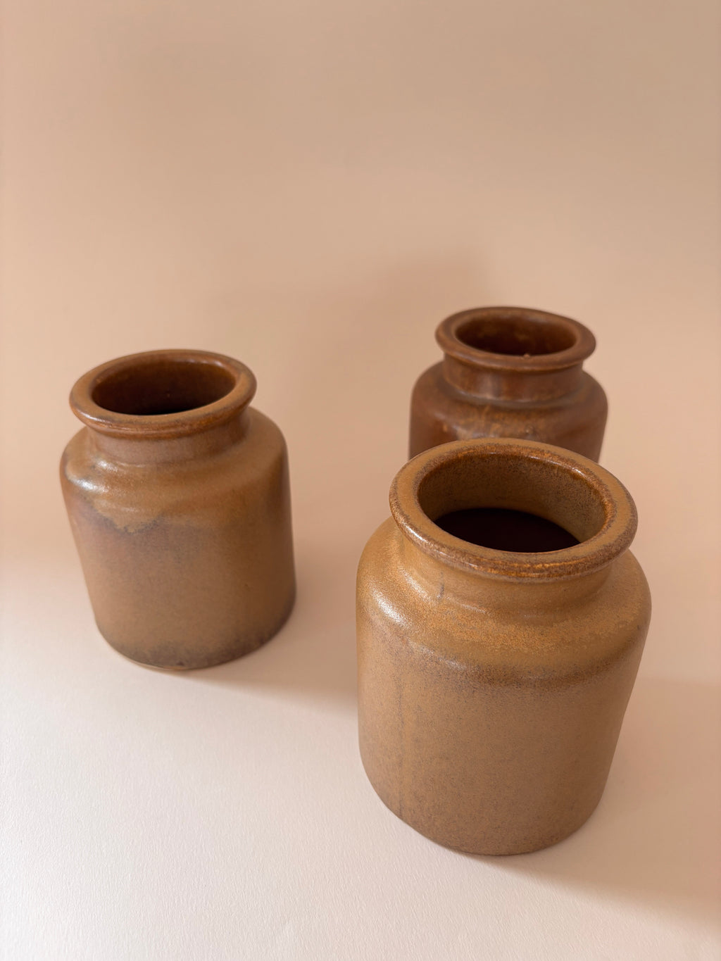 Top, face shot (looking down into the opening)
3 vintage French stoneware mustard jars seen from above