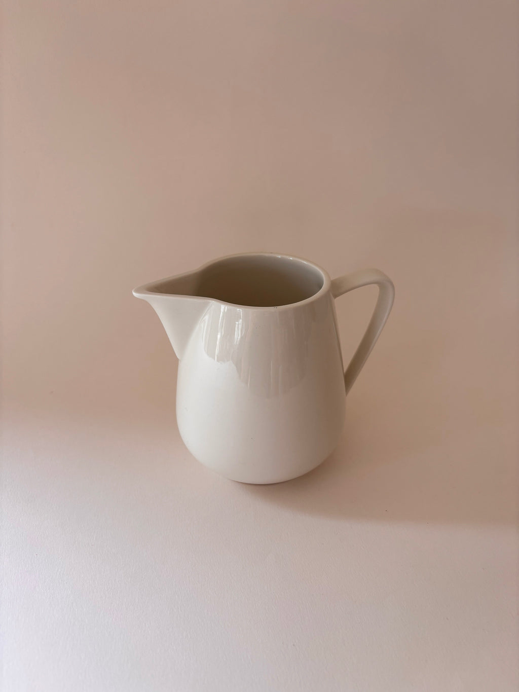 vintage Villeroy & Boch white porcelain jug with angular handle on a neutral surface