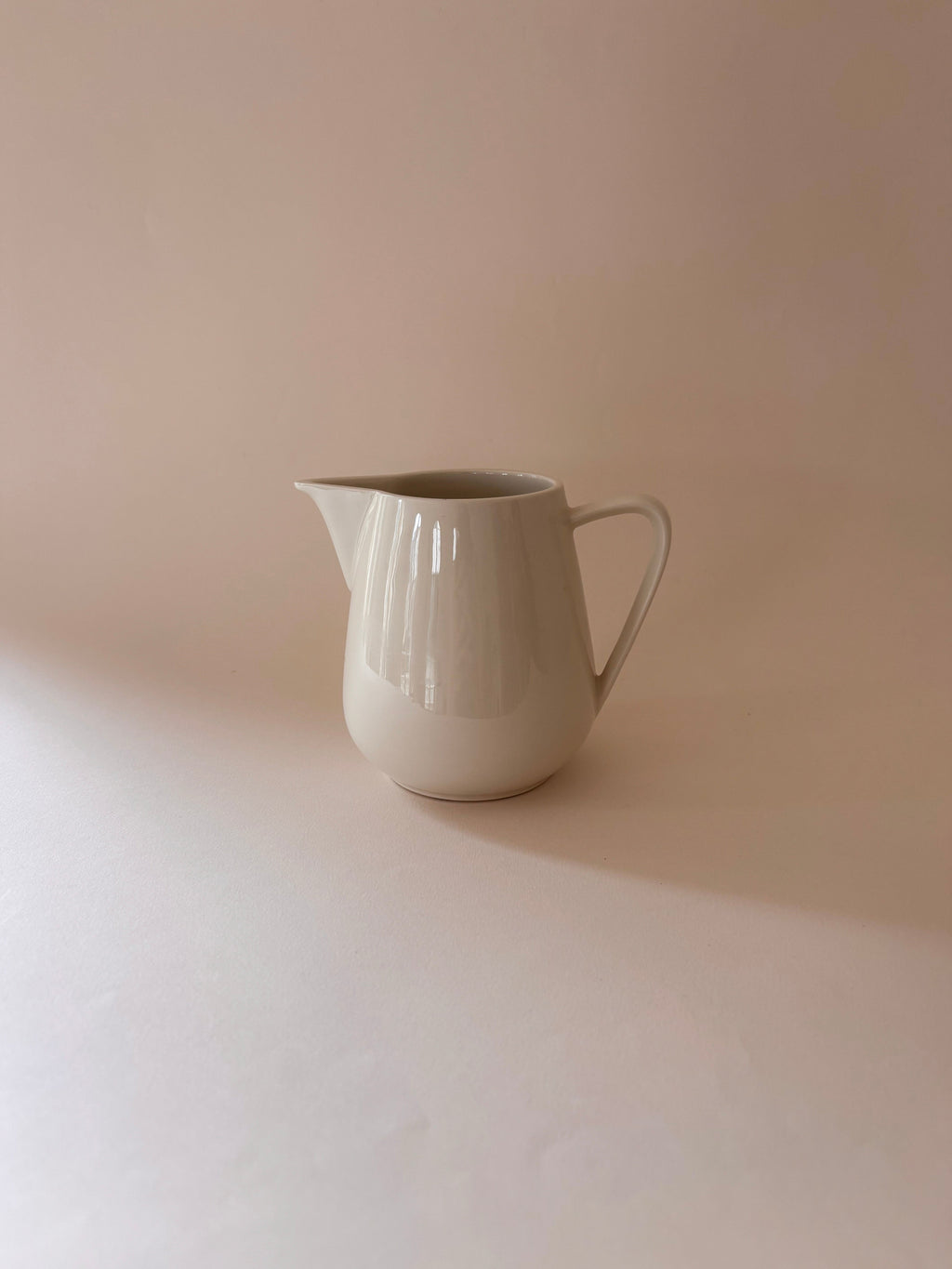 Front view of a vintage Villeroy & Boch white porcelain jug showing rounded body and wide pouring spout