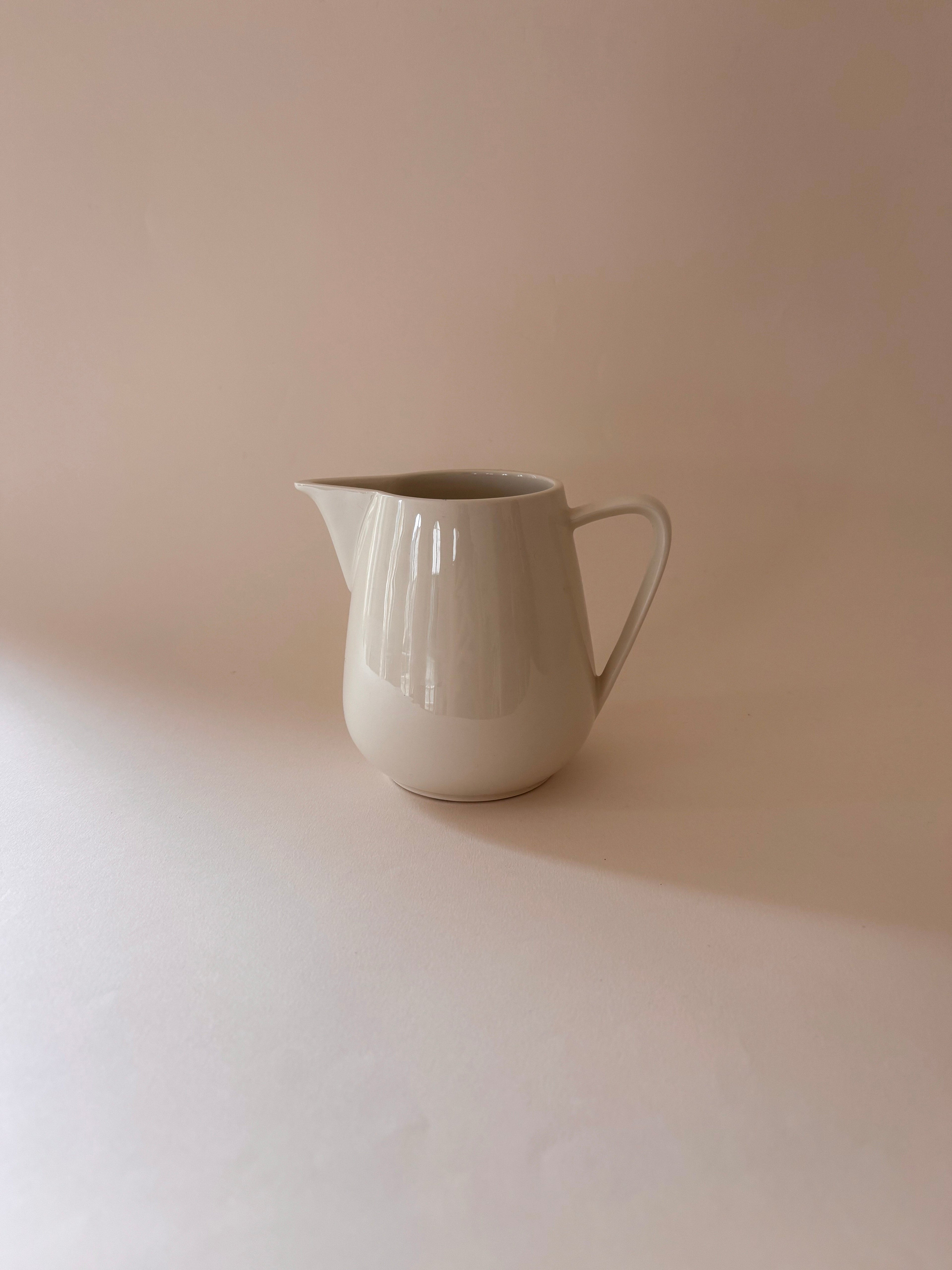 Front view of a vintage Villeroy & Boch white porcelain jug showing rounded body and wide pouring spout