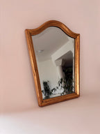 Vintage arched wall mirror with gold frame and beaded inner edge 