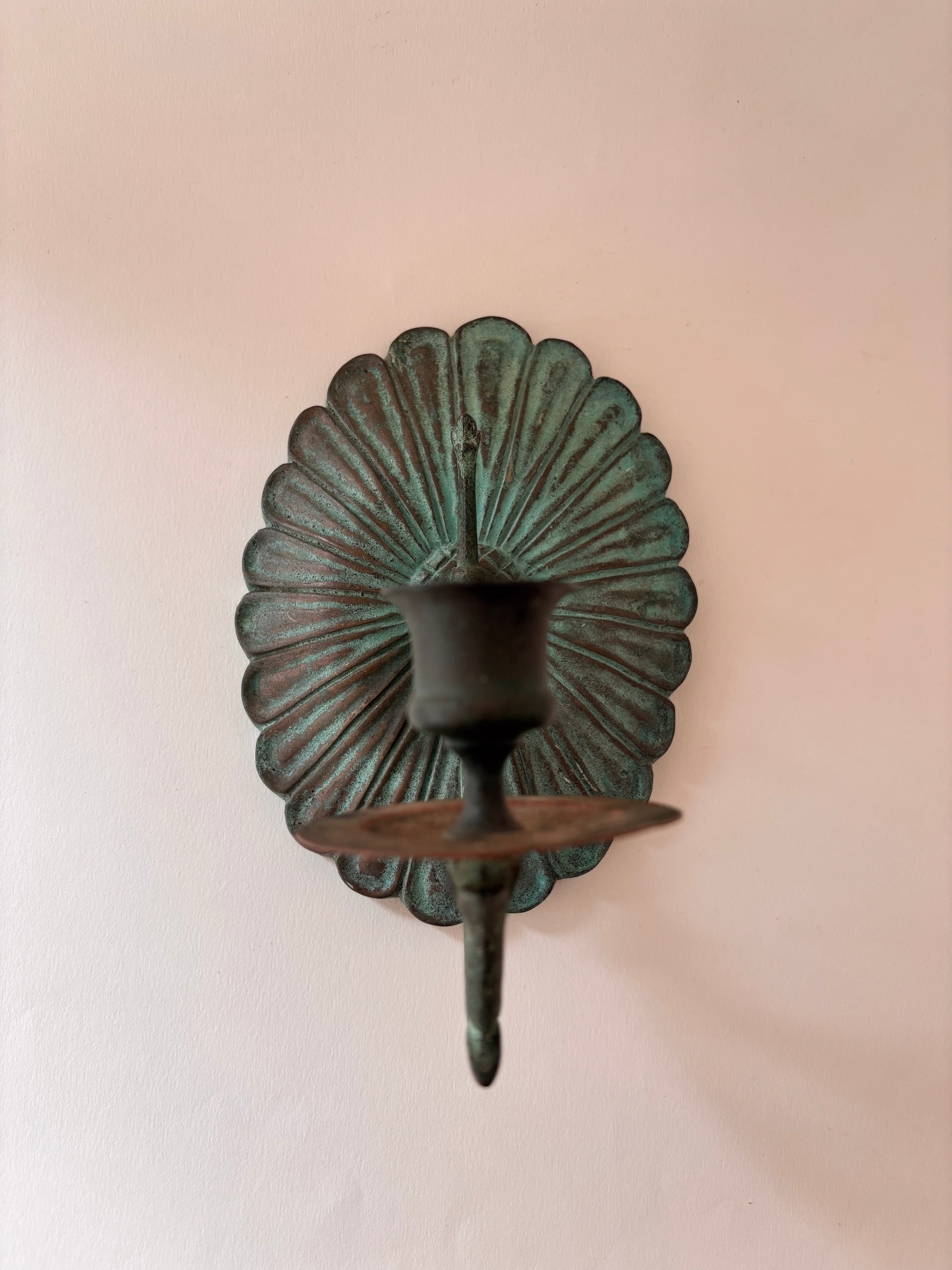 front view of a vintage brass candle sconce 