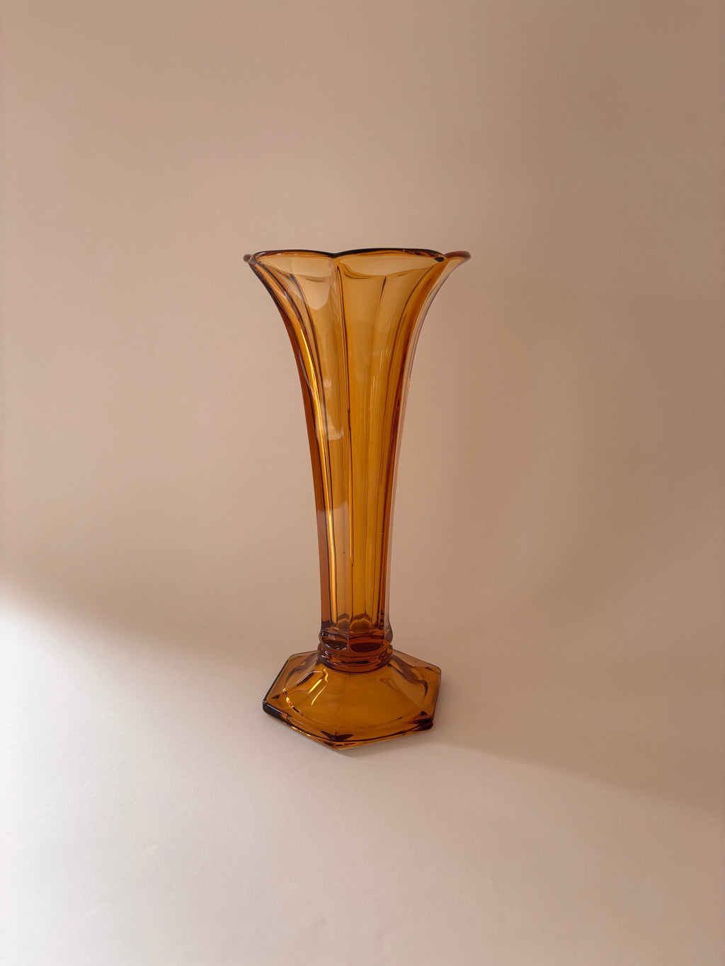 Vintage vase Val Saint Lambert amber pressed glass Art Deco on a neutral surface