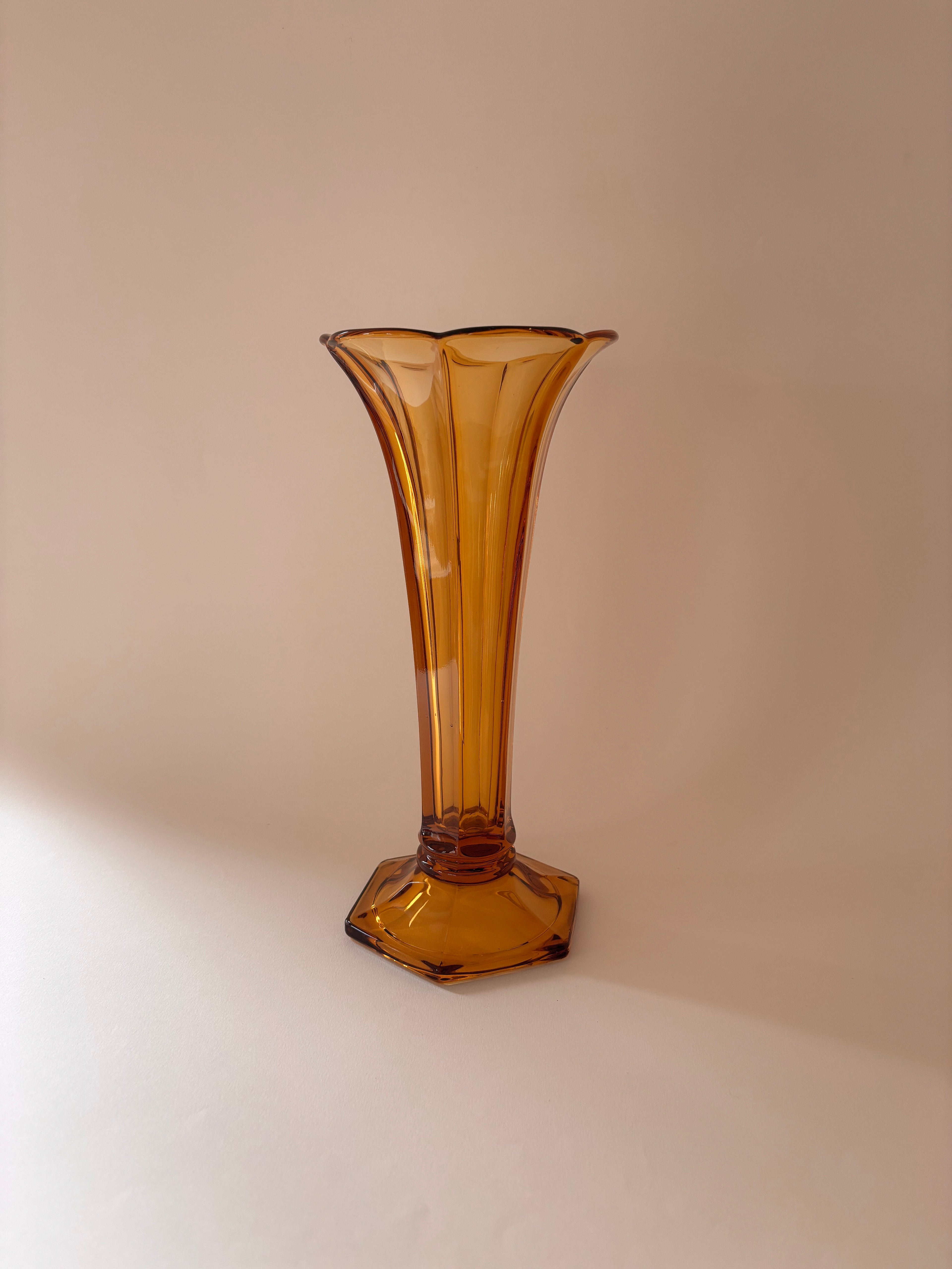 Vintage vase Val Saint Lambert amber pressed glass Art Deco on a neutral surface