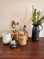 Vintage French stoneware mustard jars showing the rolled rim