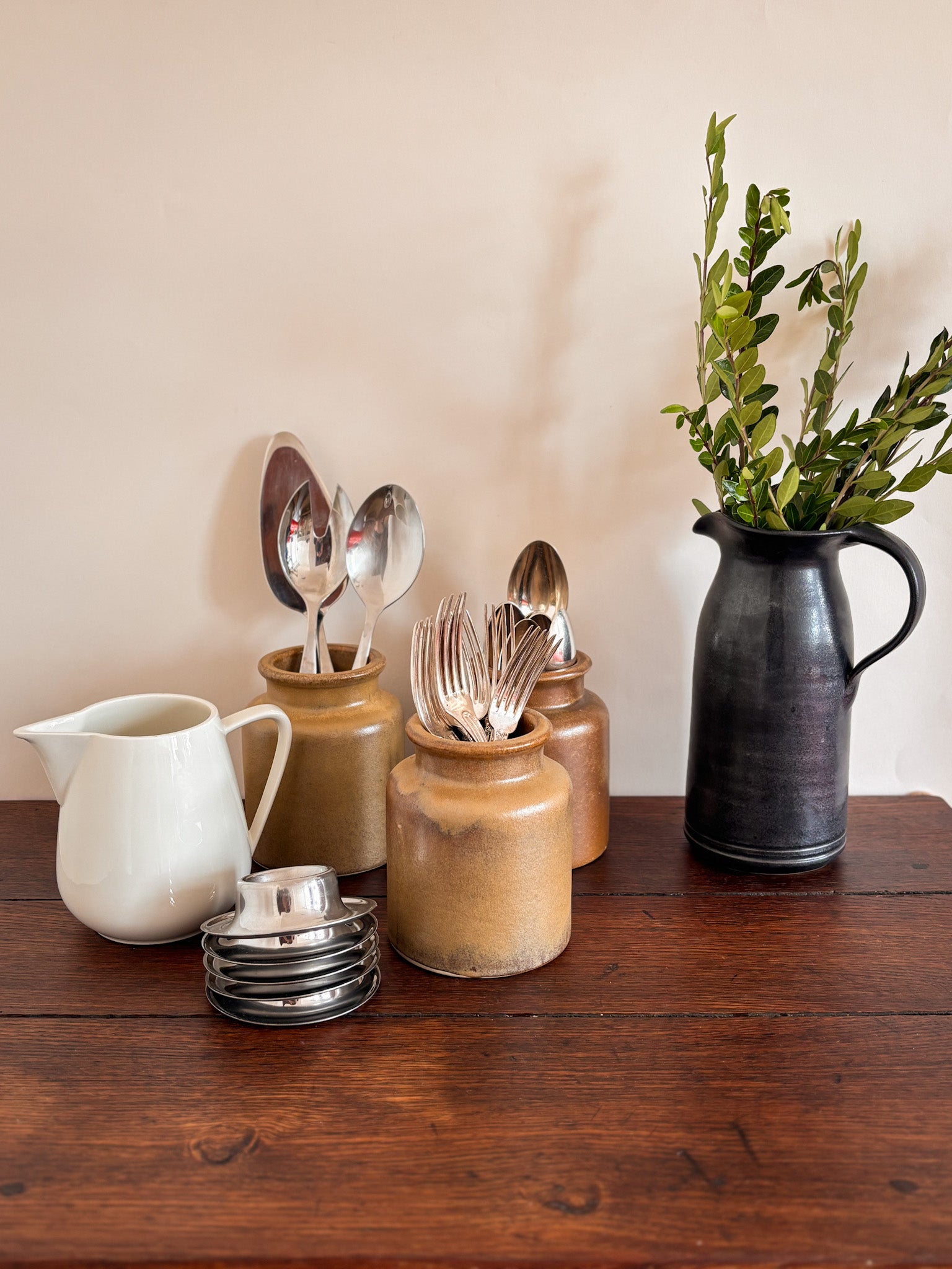 Vintage French stoneware mustard jars showing the rolled rim