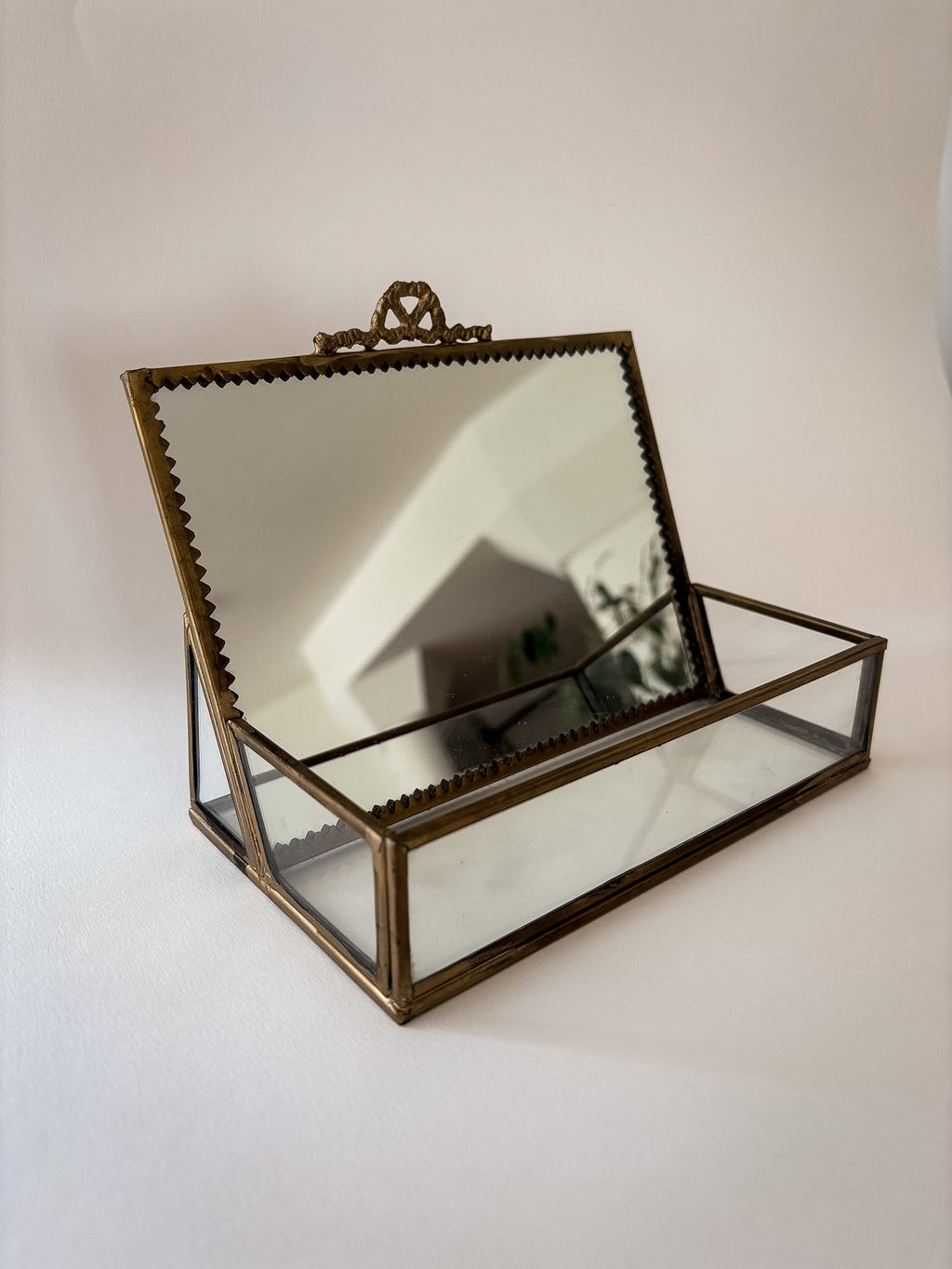 Vintage brass and glass vanity box with a mirror